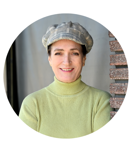 A closeup Black and white photo of Christine Zitiso, wearing a hat.